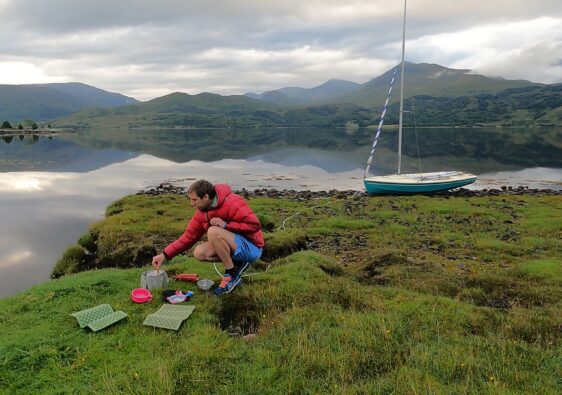 Peter is cooking breakfast on a petrol stove in Loch Etive
